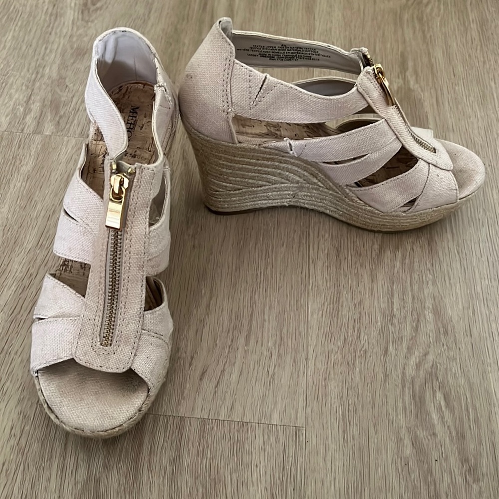 Woman’s beige wedge heels